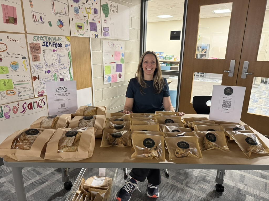 Kassidy at her Crumb Theory market table in Grand Rapids, MI